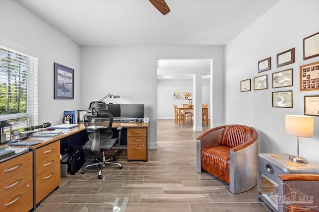 office area with wood finished floors and ceiling fan