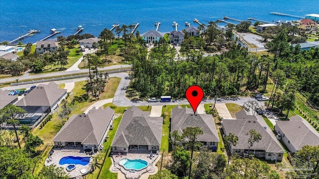 bird's eye view with a residential view and a water view
