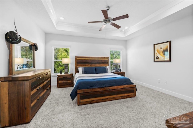 bedroom featuring recessed lighting, baseboards, carpet flooring, and a raised ceiling