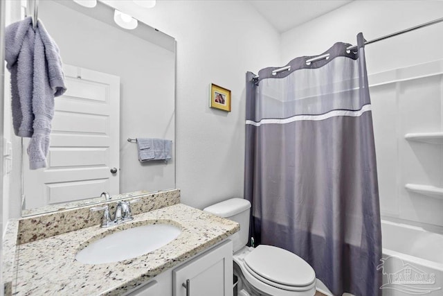 bathroom featuring shower / bath combo, toilet, and vanity