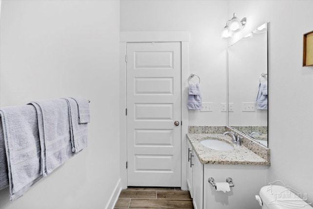 bathroom featuring wood finished floors and vanity