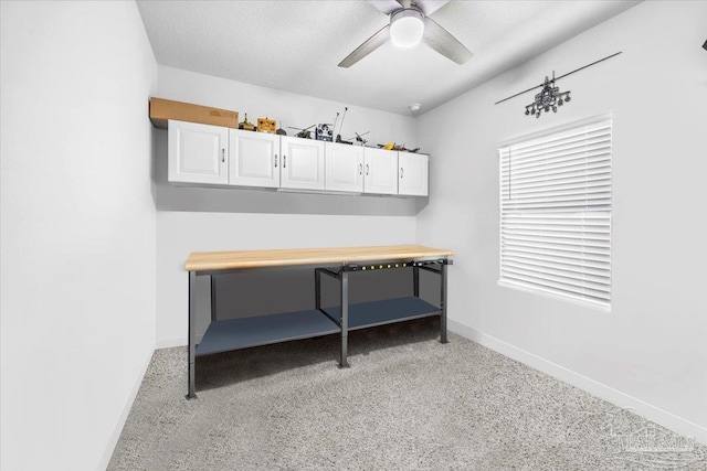 office with baseboards and a ceiling fan