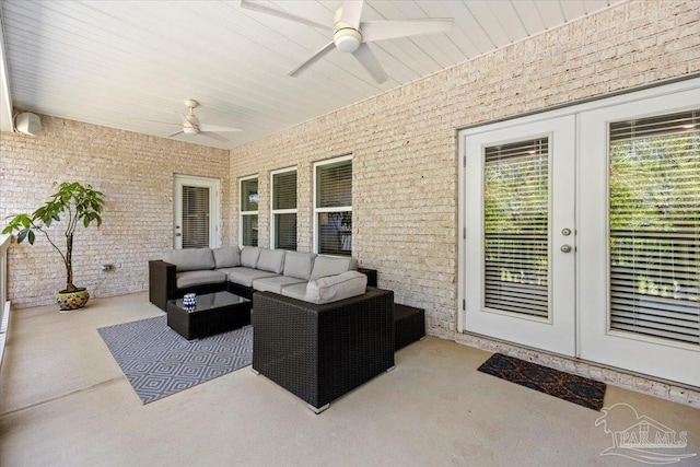 view of patio / terrace featuring an outdoor living space, a ceiling fan, and french doors
