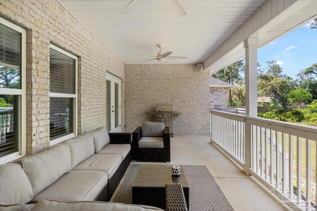 balcony with a ceiling fan, area for grilling, and an outdoor living space