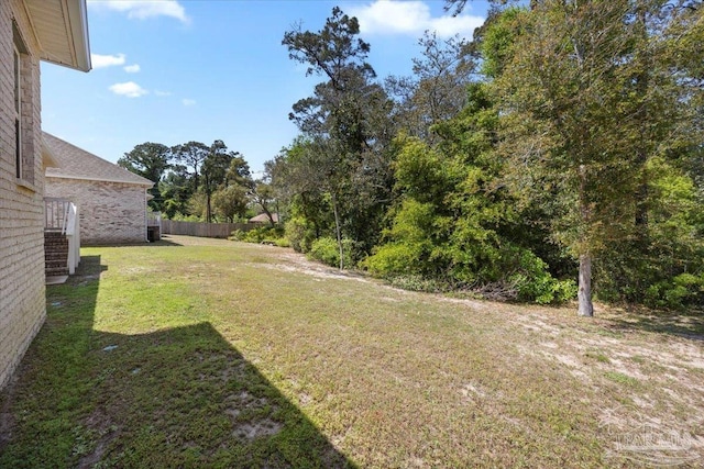 view of yard featuring fence