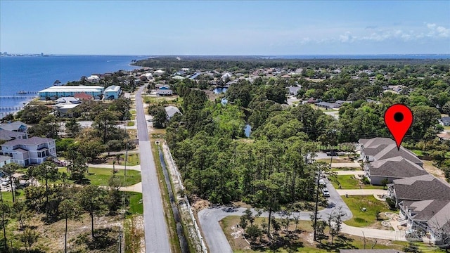 birds eye view of property featuring a water view and a residential view