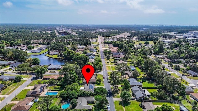 bird's eye view featuring a water view and a residential view