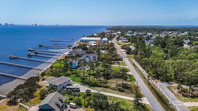 birds eye view of property with a water view and a residential view