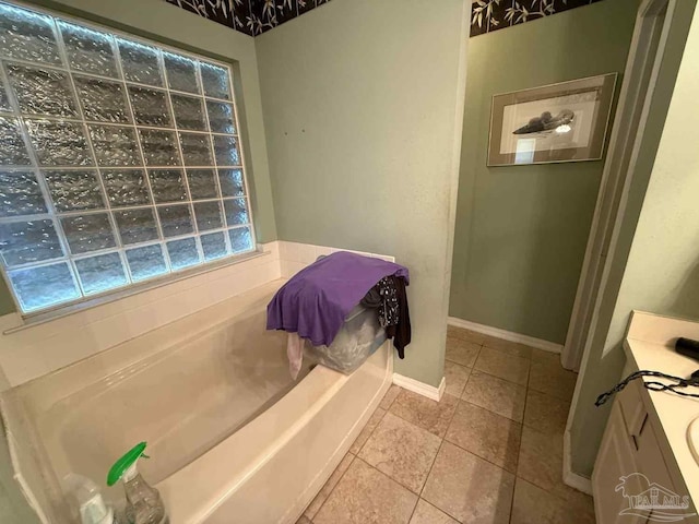 1640 Steven Dr, Gulf Breeze, FL 32563 - full bath featuring a garden tub, tile patterned flooring, and vanity