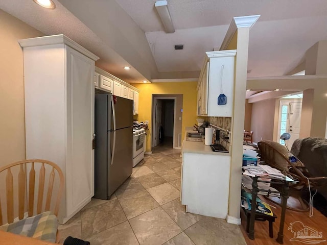 1640 Steven Dr, Gulf Breeze, FL 32563 - kitchen with freestanding refrigerator, gas range, light countertops, white cabinets, and recessed lighting