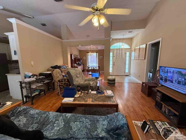 1640 Steven Dr, Gulf Breeze, FL 32563 - living area with wood finished floors, ceiling fan, lofted ceiling, and ornamental molding