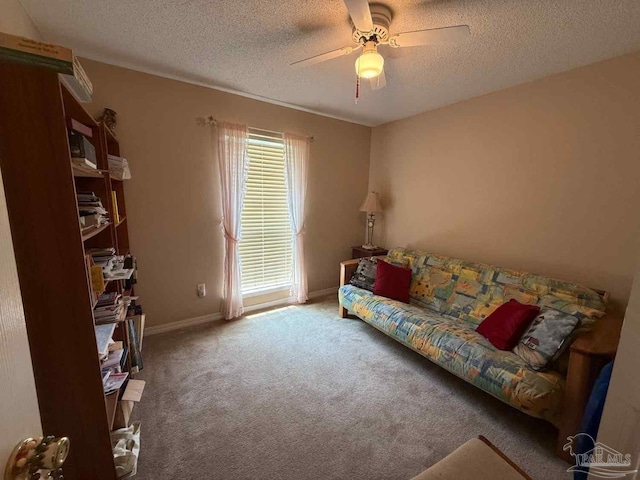 1640 Steven Dr, Gulf Breeze, FL 32563 - carpeted living area featuring ceiling fan and a textured ceiling