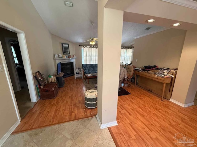 1640 Steven Dr, Gulf Breeze, FL 32563 - living room featuring ceiling fan, a fireplace, light wood-style floors, ornamental molding, and recessed lighting