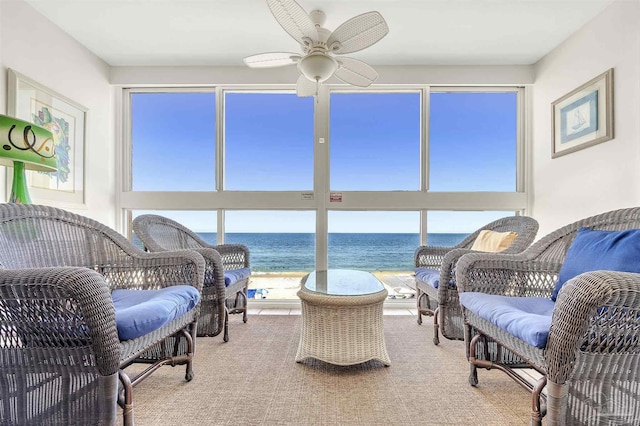 1007 W Beach Blvd Unit 53, Gulf Shores, AL 36542 - living area with a water view, ceiling fan, and carpet