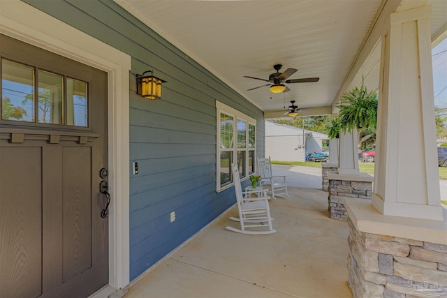 view of patio / terrace with ceiling fan and a porch