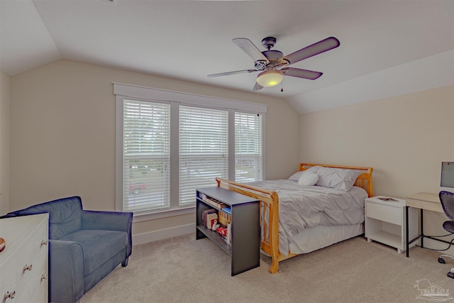 bedroom with light carpet, baseboards, lofted ceiling, and ceiling fan
