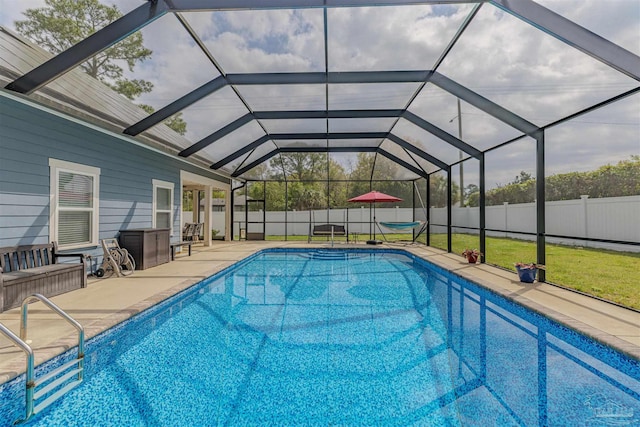 view of swimming pool featuring fence, a fenced in pool, a lanai, and a patio area