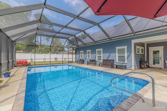 view of pool with a fenced in pool, a lanai, fence, and a patio area