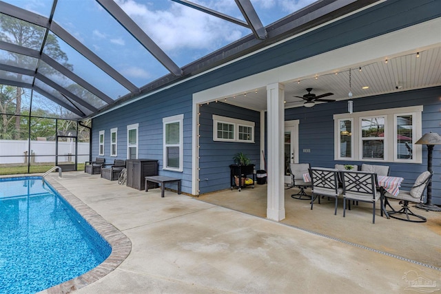 view of pool with a ceiling fan, a fenced in pool, fence, and a patio area