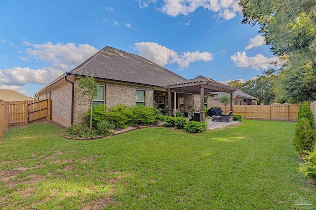 rear view of property featuring a pergola, a patio area, and a yard