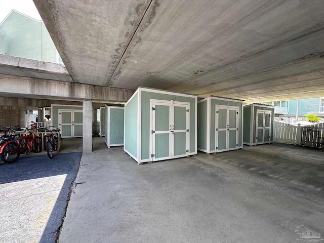 16310 Perdido Key Dr Unit 13A, Pensacola, FL 32507 - garage with a storage shed and fence