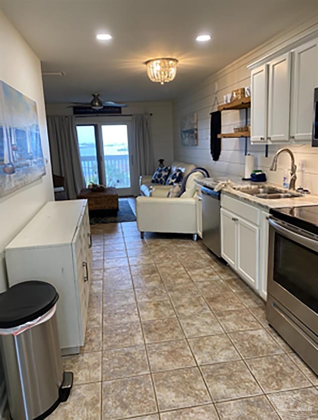 16310 Perdido Key Dr Unit 13A, Pensacola, FL 32507 - kitchen with appliances with stainless steel finishes, a sink, open floor plan, recessed lighting, and light countertops