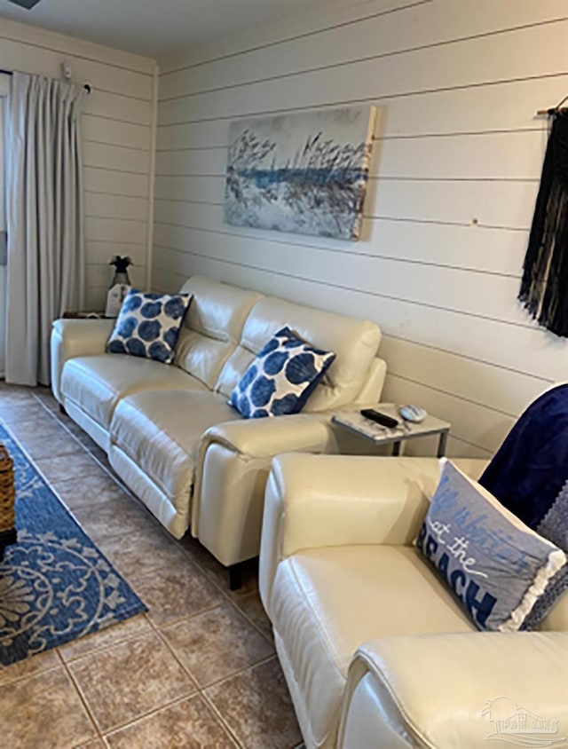 16310 Perdido Key Dr Unit 13A, Pensacola, FL 32507 - living area featuring wood walls and dark tile patterned flooring