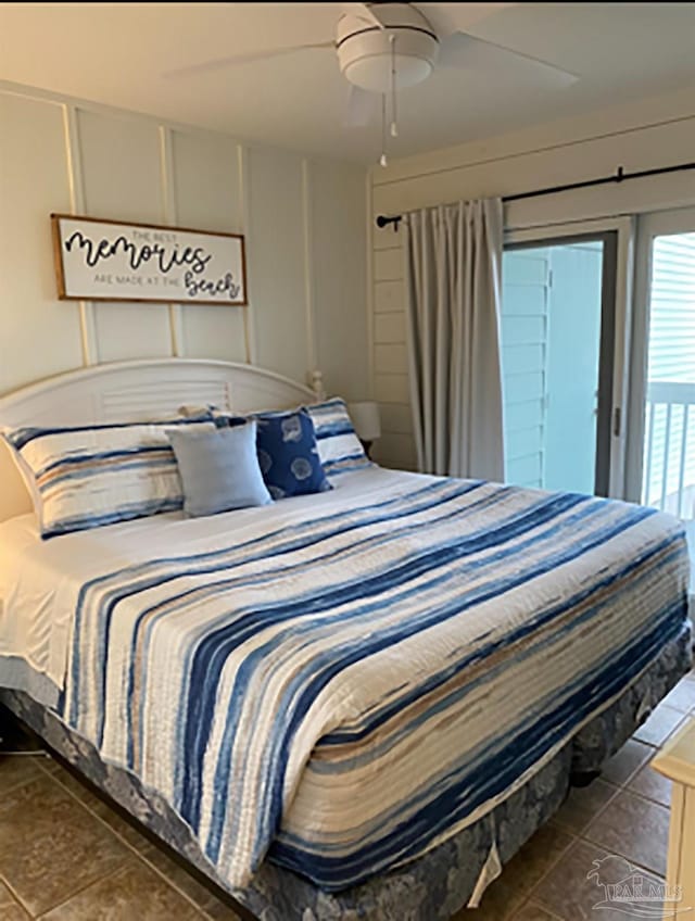 16310 Perdido Key Dr Unit 13A, Pensacola, FL 32507 - bedroom with access to exterior, a ceiling fan, a decorative wall, and tile patterned floors