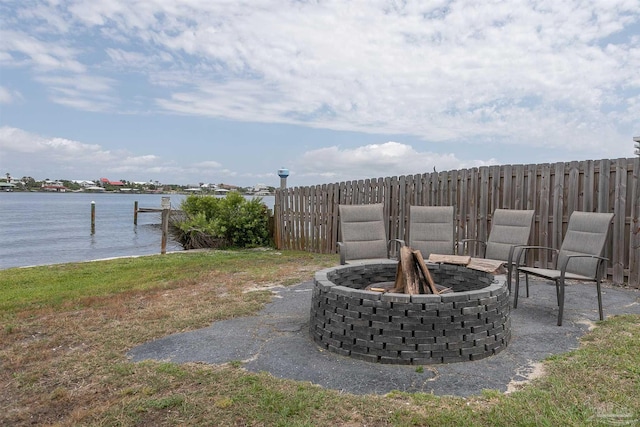 16310 Perdido Key Dr Unit 13A, Pensacola, FL 32507 - view of yard with a fire pit, a water view, fence, and a dock