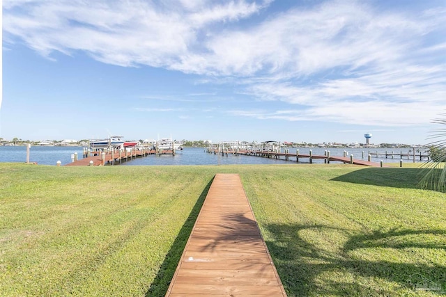 dock area featuring a lawn, a water view, and boat lift
