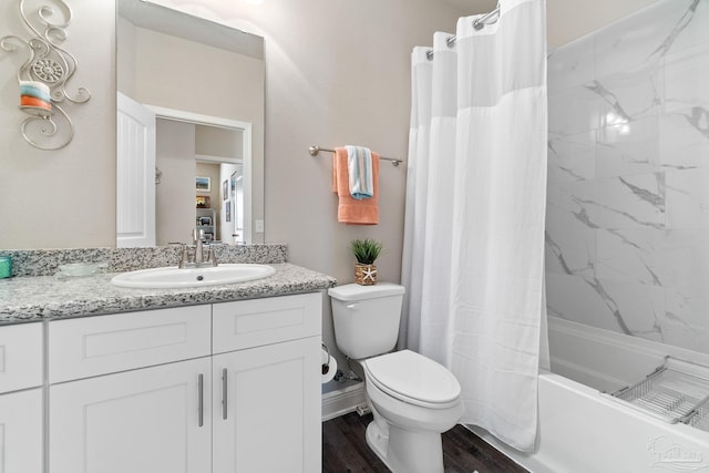 full bathroom featuring vanity, toilet, wood-type flooring, and shower / bath combo