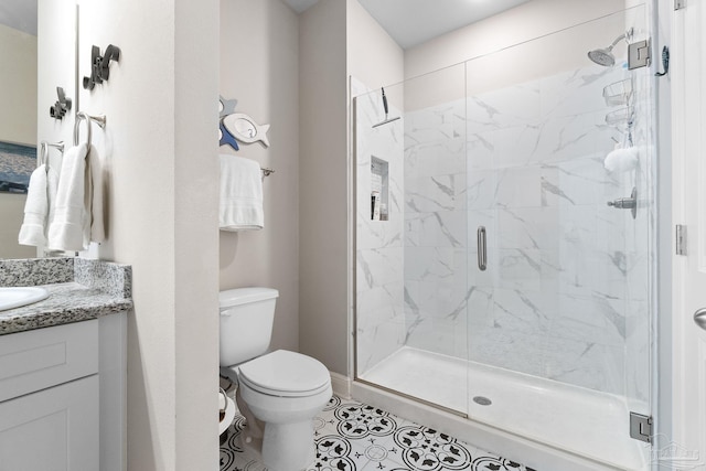 bathroom with vanity, toilet, an enclosed shower, and tile patterned flooring