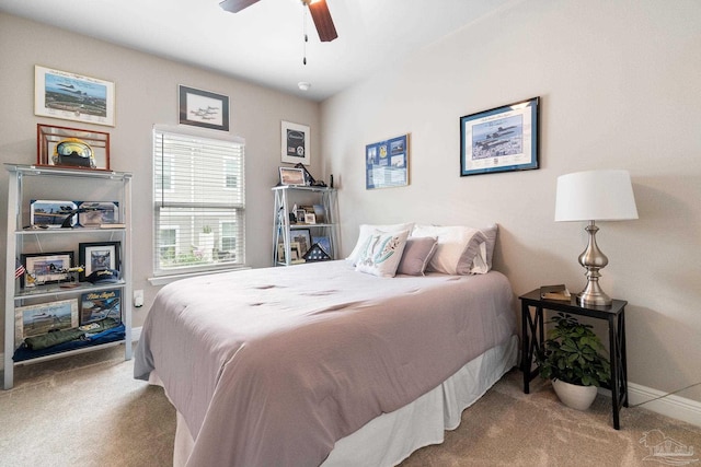 carpeted bedroom with ceiling fan