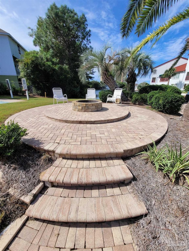 view of patio featuring an outdoor fire pit