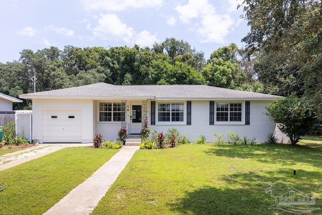 ranch-style home featuring a garage and a front lawn