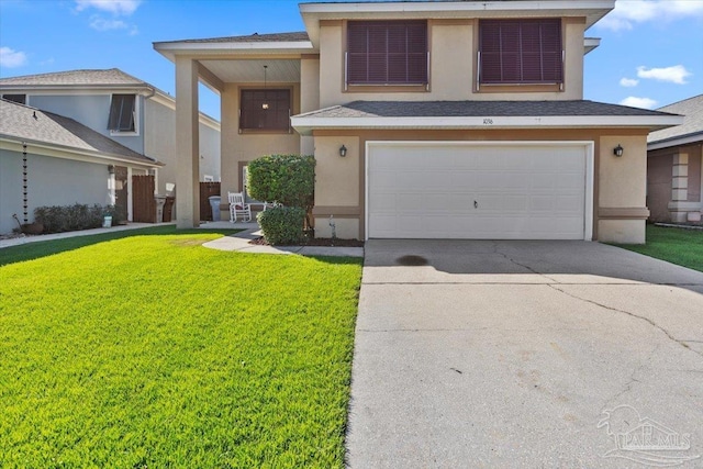 view of front of home with a front lawn and a garage