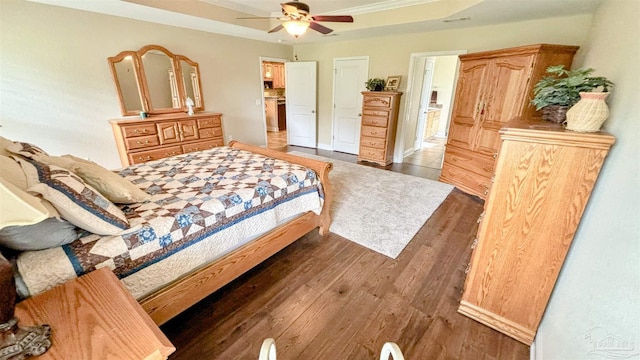 6214 Plum Orchard Way, Crestview, FL 32536 - bedroom featuring wood finished floors, a raised ceiling, and ceiling fan