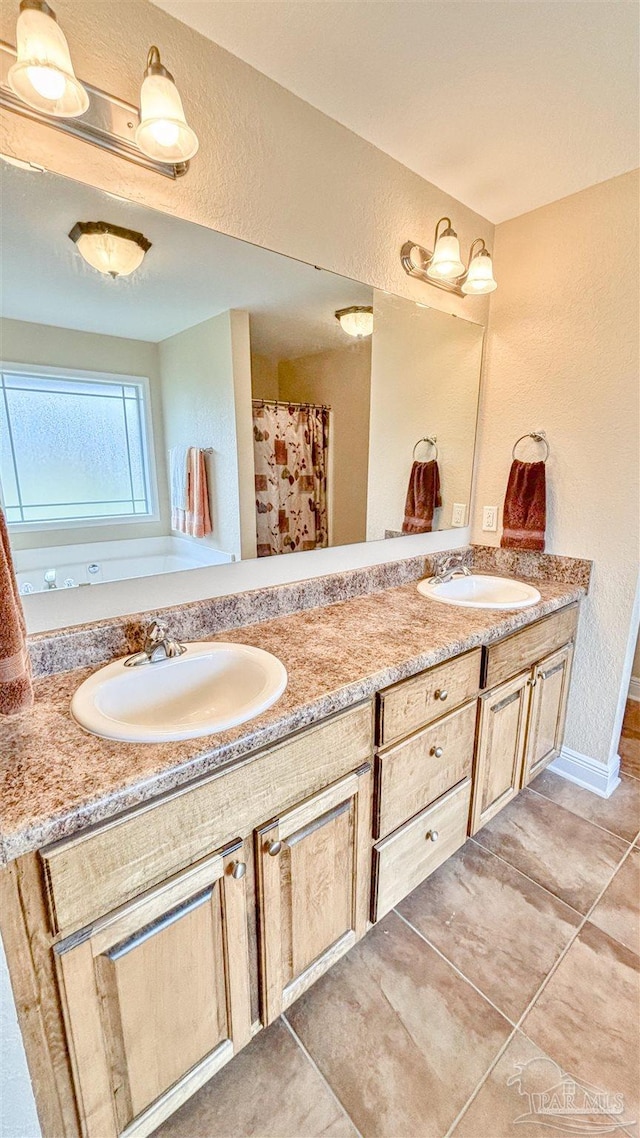 6214 Plum Orchard Way, Crestview, FL 32536 - bathroom with a textured wall, tile patterned flooring, and double vanity