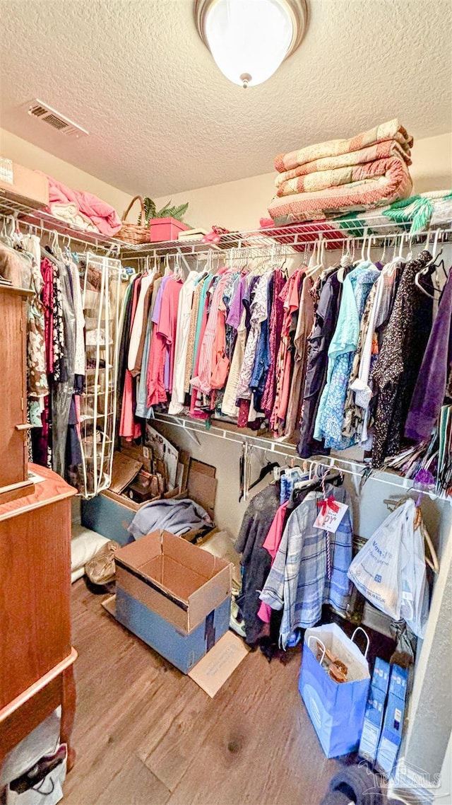 6214 Plum Orchard Way, Crestview, FL 32536 - spacious closet featuring wood finished floors