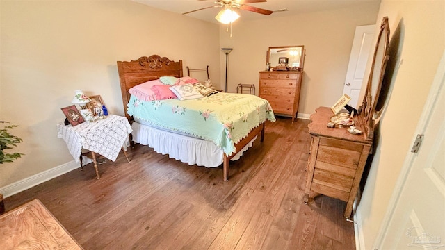 6214 Plum Orchard Way, Crestview, FL 32536 - bedroom with wood finished floors, baseboards, and a ceiling fan