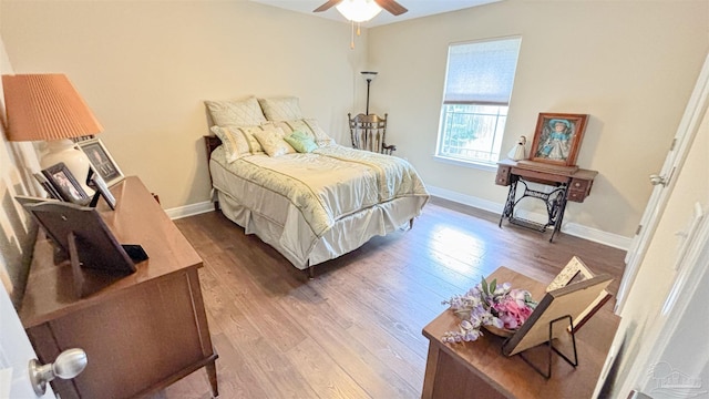 6214 Plum Orchard Way, Crestview, FL 32536 - bedroom with wood finished floors, baseboards, and ceiling fan