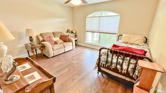 6214 Plum Orchard Way, Crestview, FL 32536 - bedroom with multiple windows, wood finished floors, baseboards, and ceiling fan