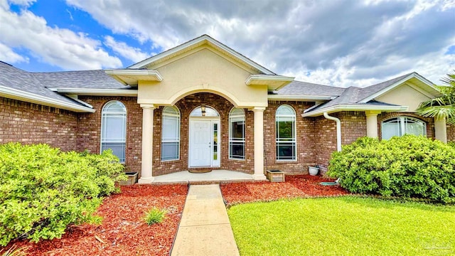 6214 Plum Orchard Way, Crestview, FL 32536 - entrance to property with brick siding, a yard, and a shingled roof