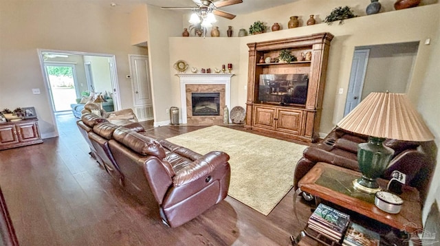 6214 Plum Orchard Way, Crestview, FL 32536 - living area featuring ceiling fan, dark wood-style floors, a premium fireplace, a high ceiling, and baseboards