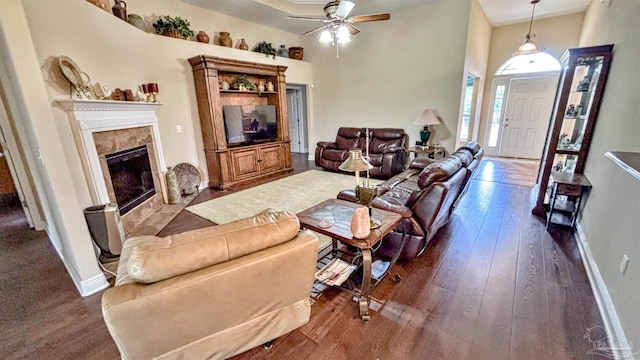 6214 Plum Orchard Way, Crestview, FL 32536 - living room featuring ceiling fan, a fireplace, dark wood-type flooring, baseboards, and a high ceiling