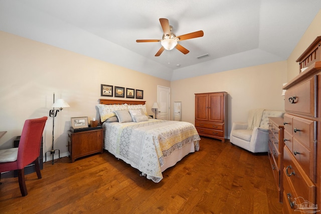 bedroom with dark hardwood / wood-style floors, ceiling fan, and lofted ceiling