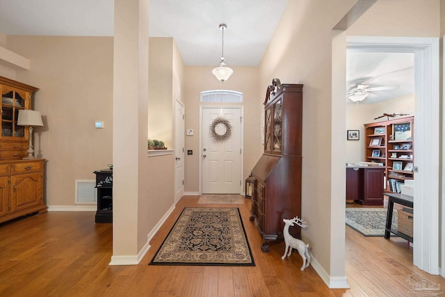 entrance foyer with ceiling fan and light wood-type flooring