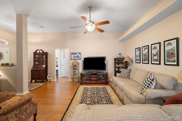 living room featuring light hardwood / wood-style floors and ceiling fan