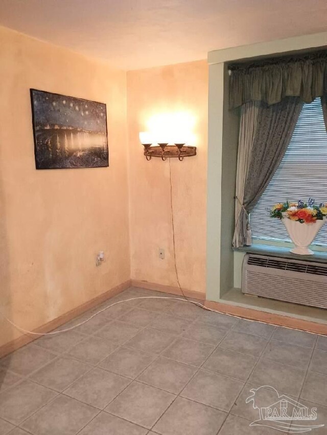 224 E Garden St Unit 306, Pensacola, FL 32502 - unfurnished room featuring baseboards and tile patterned floors