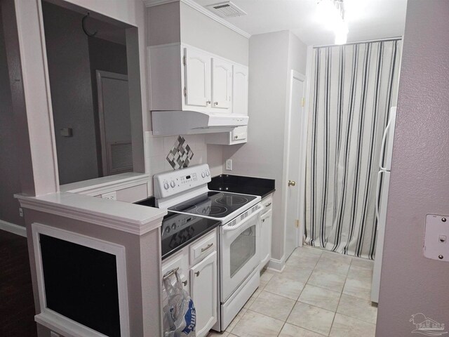 2201 Scenic Hwy Unit E-7, Pensacola, FL 32503 - kitchen with white electric range, white cabinetry, light tile patterned floors, and under cabinet range hood